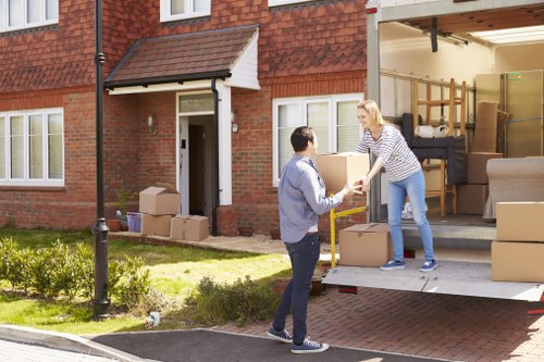 Van moving team preparing equipment before a safe relocation job