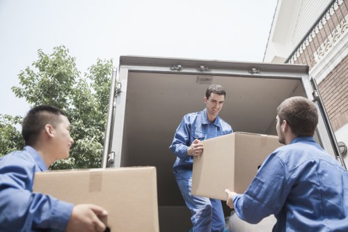 Packing and loading items into a moving van in South Hackney