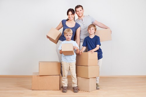 Packed moving boxes and furniture ready for a South Hackney house move