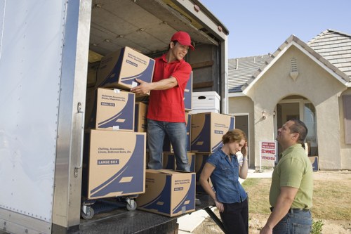 Office movers unloading equipment at a commercial property