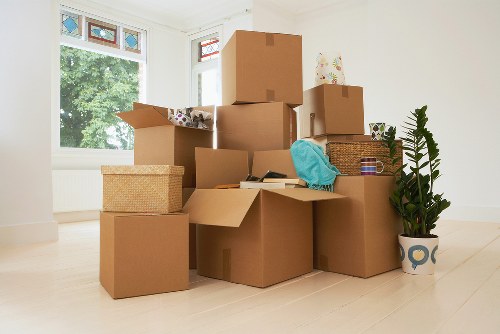 Professional movers handling furniture in a South Hackney property