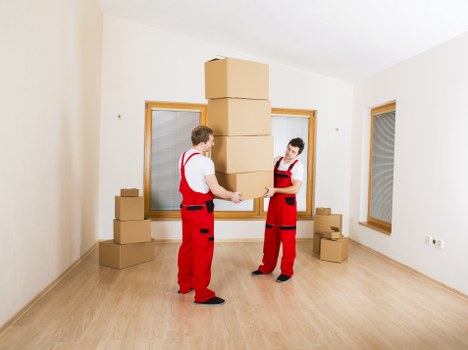 Packed office boxes ready for a commercial relocation in East London